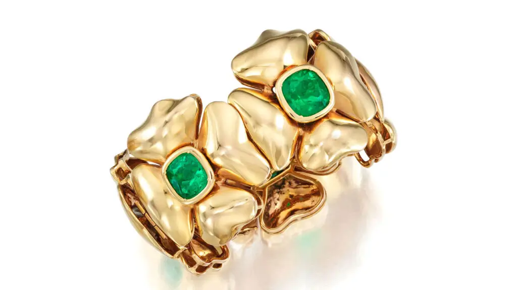 A bracelet featuring five cushion-cut Colombian emeralds weighing a total of 35 carats, each within a quatrefoil flower motif at Bonhams image