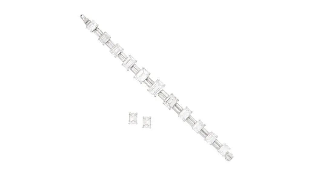 This Aldao set comprises a bracelet and a pair of ear studs. The bracelet has step-cut diamonds graduating in size toward the center, alternating between links with duos of baguette-cut diamonds. Each of the ear studs contains a step-cut diamond, weighing 1.45 and 1.50 carats at Bonhams image