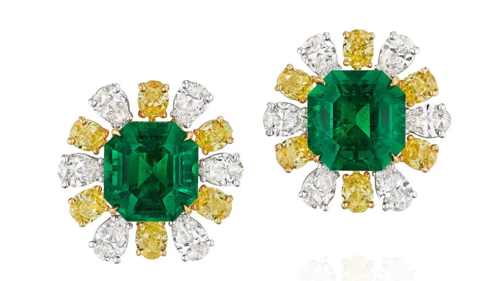 Each of these ear clips sports an emerald-cut Colombian emerald — weighing 5.15 and 5.59 carats respectively — in a surround of pear-shaped diamonds alternating with oval-shaped, yellow-tinted diamonds at Bonhams image