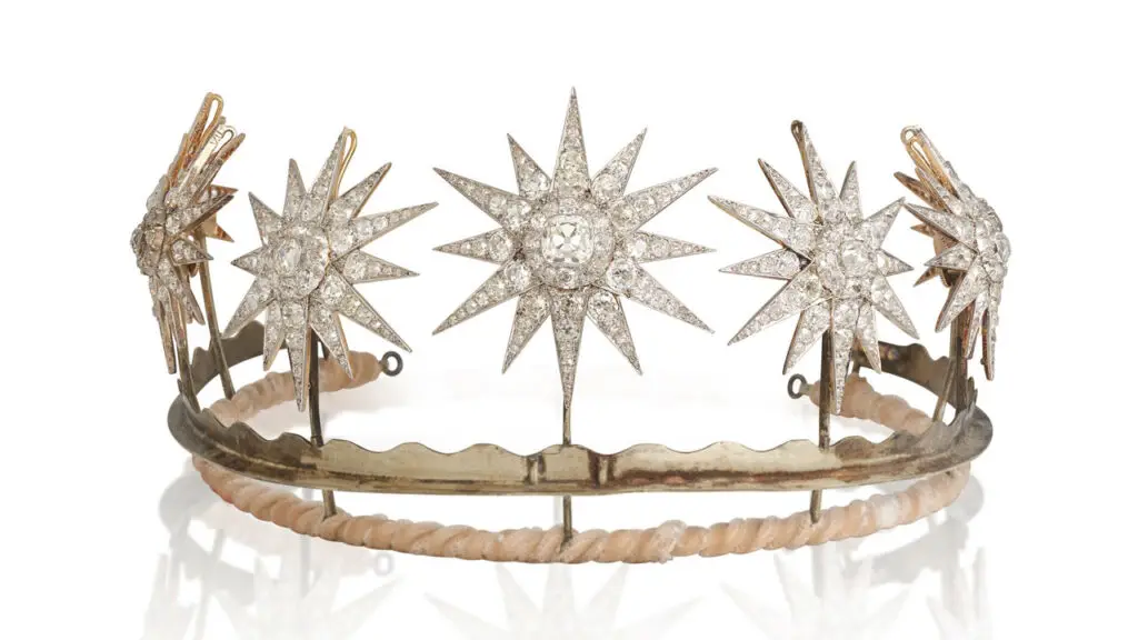 This transformable piece from circa 1880 or later — which can serve as a tiara, a coronet, or a series of eight star brooches — belonged to Lady Anne Glenconner, a former royal lady-in-waiting to the UK’s Princess Margaret. It comprises eight stars, graduating in size toward the center, with old brilliant-, old single-, rose- and cushion-cut diamonds. The center diamond of the largest star weighs 3.50 carats; the remaining diamonds total some 75 carats at Bonhams image