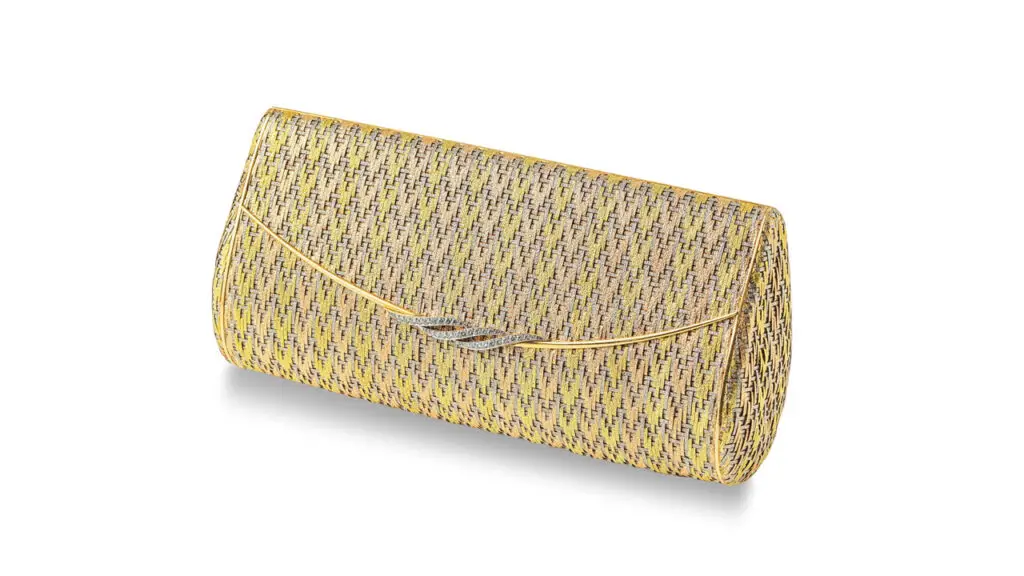 A Cartier gold and diamond evening clutch, in woven design and featuring brilliant-cut diamonds at Bonhams image