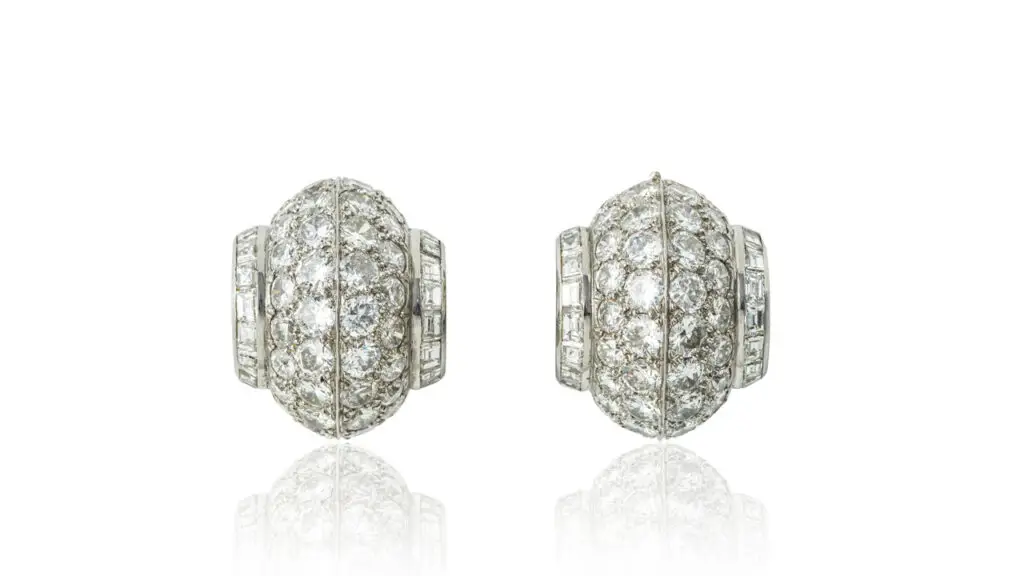 Van Cleef & Arpels bombé design ear clips from around 1935, bearing pavé-set brilliant-cut diamonds between baguette stones at Bonhams image