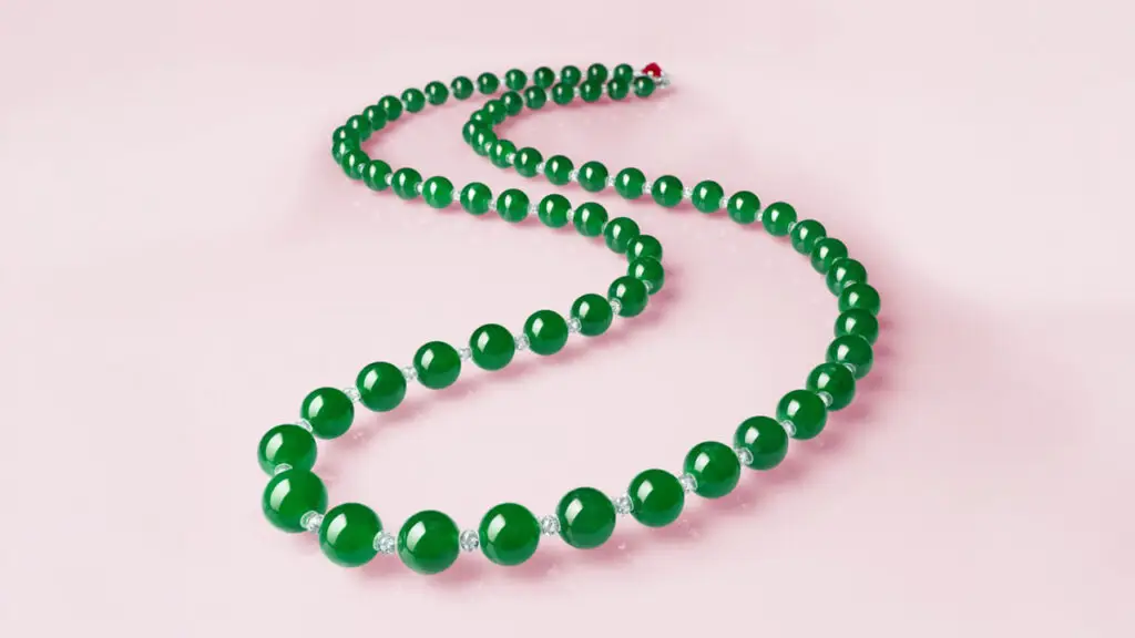 A necklace comprising 68 jadeite beads with a 4.53-carat Burmese ruby, and pear-shaped diamonds and diamond beads at Christie's image
