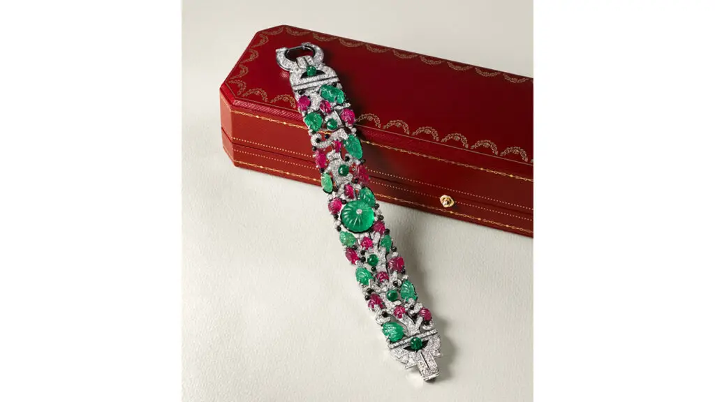 A Cartier Art Deco multi-gem tutti frutti bracelet features carved emeralds, rubies and onyx, emerald and onyx beads, and single and old-cut diamonds at Christie's image
