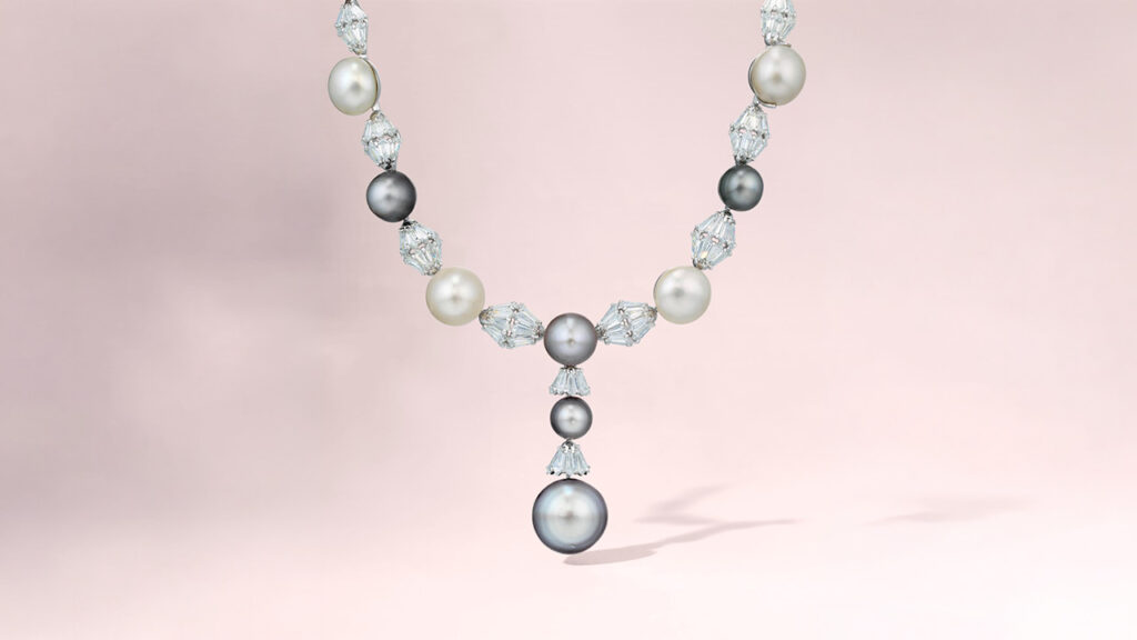 A necklace comprising 16 button-shaped white and grey saltwater natural pearls alternating with kite-shaped diamonds at Christie's image