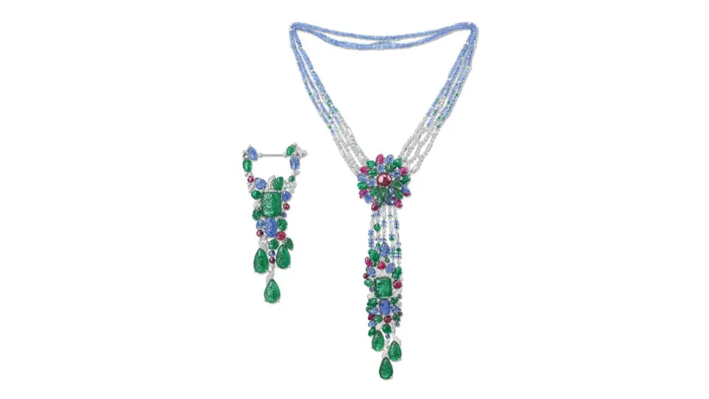 A Cartier multi-gem necklace and brooch. The tutti frutti pieces feature carved emeralds, sapphires and rubies, oval-shaped cabochon ruby, sapphire, emerald and ruby beads and round diamonds at Christie's image