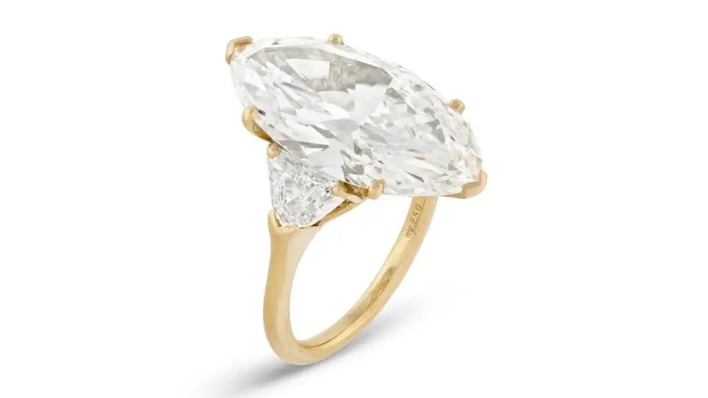 A ring bearing a marquise brilliant-cut, 9.29-carat, F-color, VS1-clarity diamond between two triangular-shaped diamonds at Christie's image