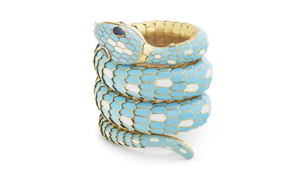 A Bulgari Serpenti bracelet circa 1965, featuring blue and white enamel and pear-shaped sapphire eyes and 18-karat yellow gold at Christie's image