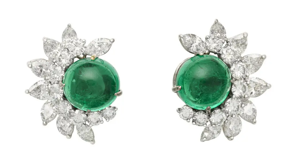 A pair of earrings featuring Colombian emerald cabochons weighing 11.41 and 12.71 carats, with a semi-surround of marquise, pear-shaped and round diamonds totaling around 8 carats at Christie's image