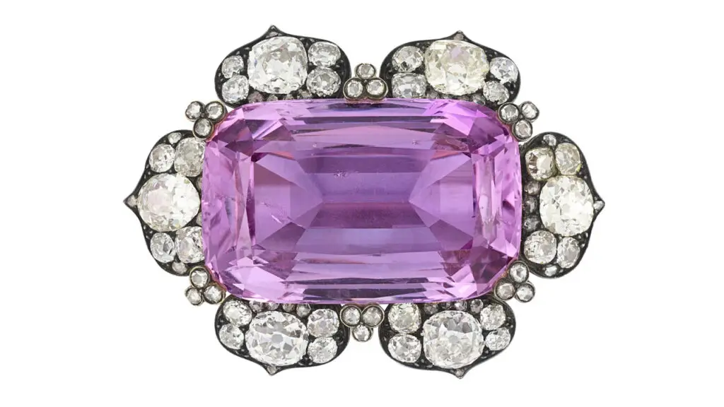 A brooch from around 1890 centers an antique cushion-shaped pink imperial topaz in a frame of old circular-, cushion- and rose-cut diamonds. It made more than six times its high presale price at Christie's image