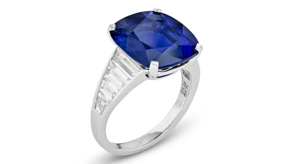 A ring starring a cushion-shaped, 7.71-carat Madagascar sapphire, with at baguette-cut and trapeze-shaped diamonds on the band at Christie's image