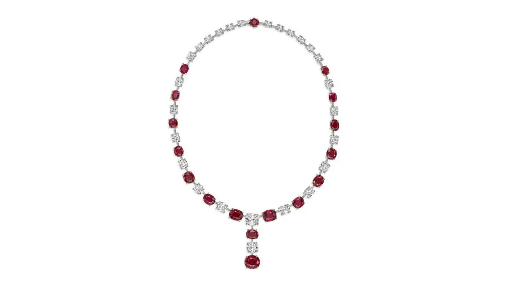 A David Morris necklace comprises oval and cushion mixed-cut Burmese rubies weighing from 1.02 to 5.03 carats, alternating between cushion and round diamonds. The two large diamonds are a 2.23-carat, F, VS2 diamond and a 3.34-carat, F, VVS2 stone at Christie's image