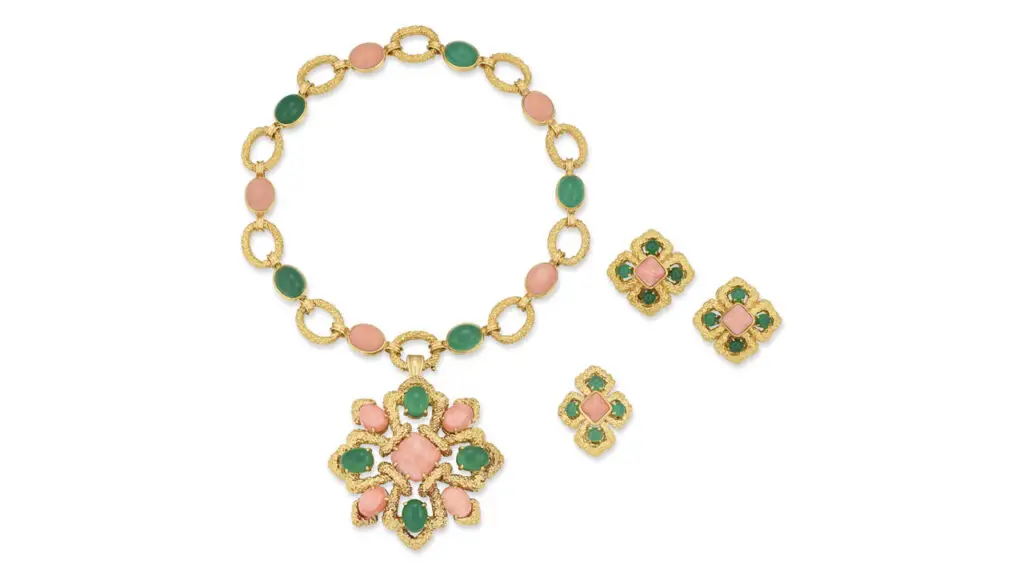 A Van Cleef & Arpels parure comprising a choker necklace that converts into two bracelets, a pendant/brooch, a pair of earrings and a ring. The pieces are designed with square sugarloaf and oval cabochon coral, oval and circular cabochon chrysoprase and gold at Christie's image