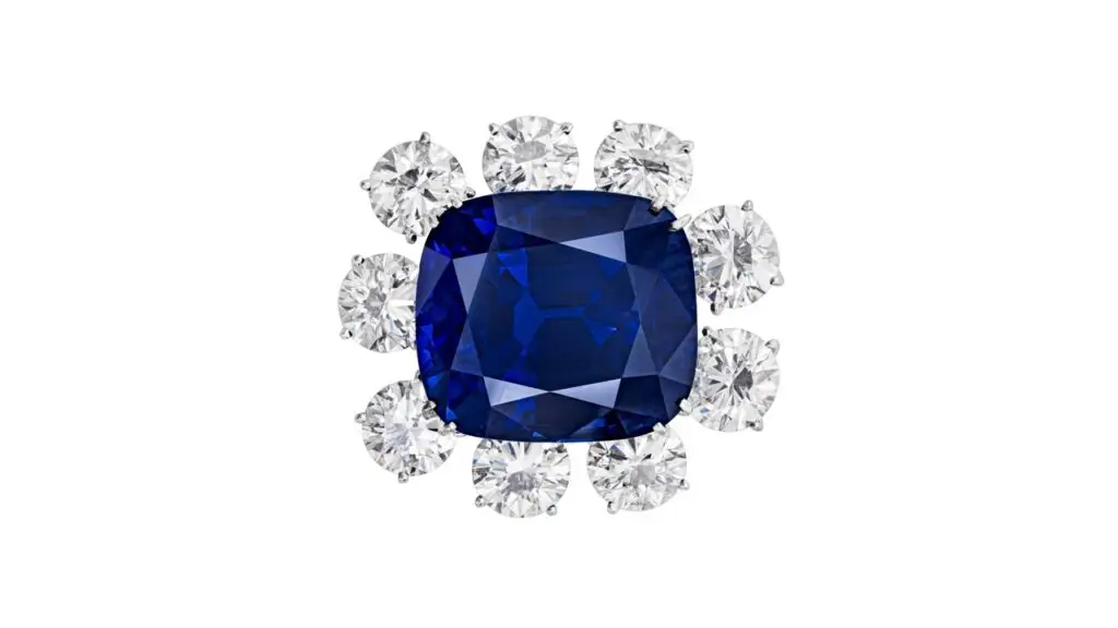 This brooch sports a cushion-shaped, 65.46-carat, royal-blue Burmese sapphire surrounded by nine round brilliant-cut diamonds weighing between 1.60 and 2.12 carats at Christie's image