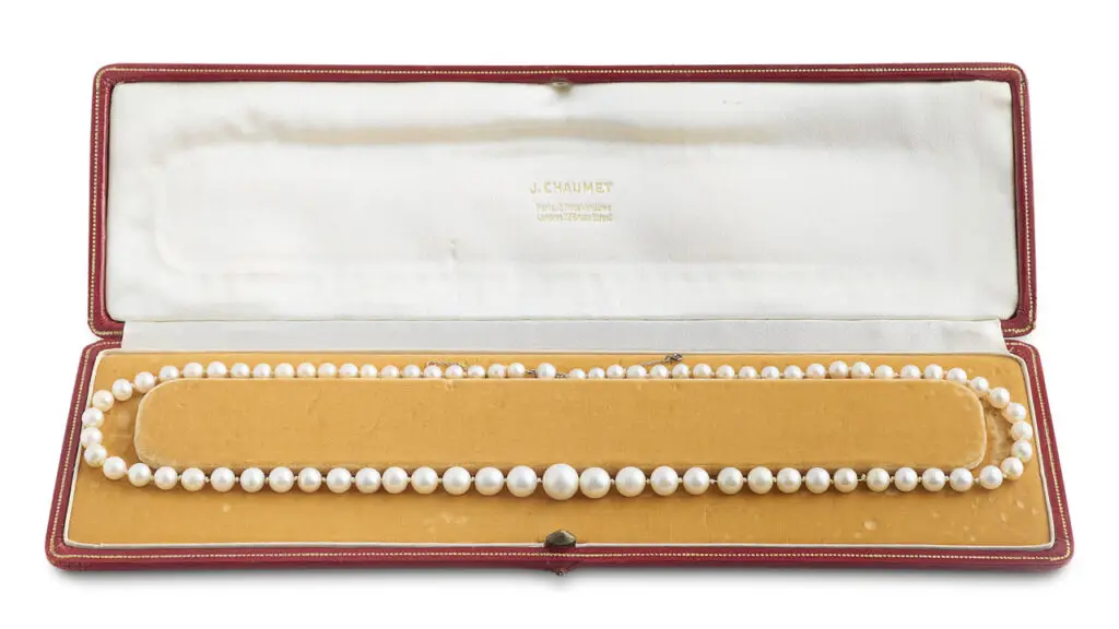 Chaumet designed this necklace in 1947. It comprises 78 round, oval and button-shaped pearls, 76 of which are listed as natural at Christie's image