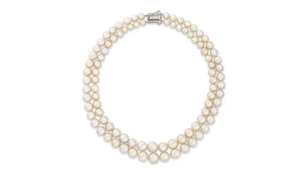 A necklace featuring two strands of graduated natural pearls and old- and baguette-cut diamonds, created around 1920 at Christie's image