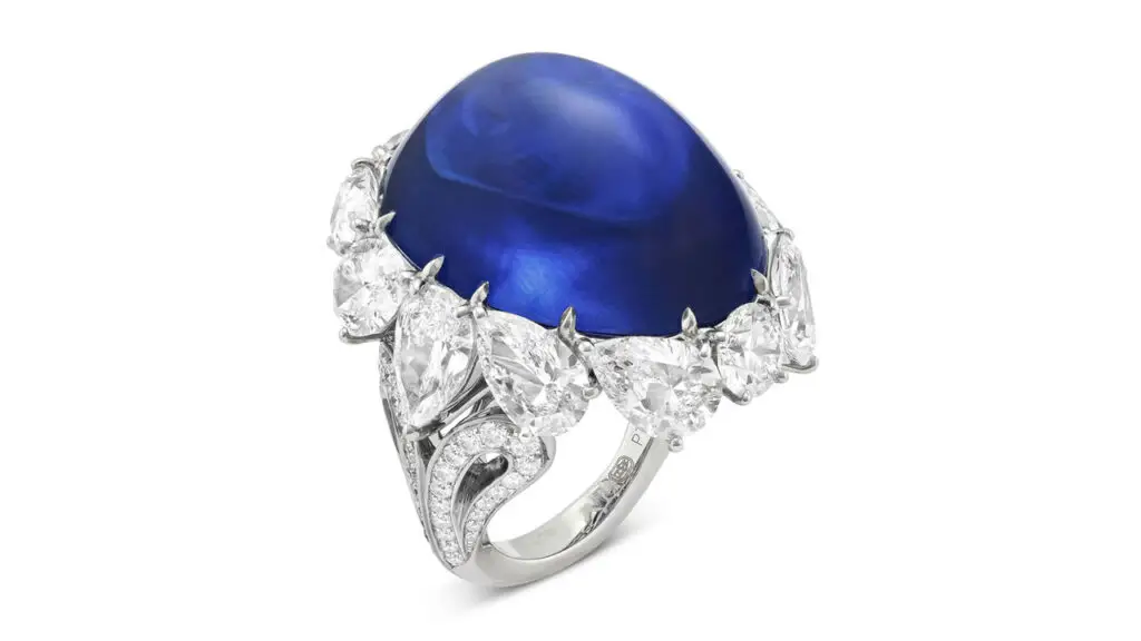 From Harry Winston, this ring contains an oval-shaped, 76.39-carat cabochon Burmese sapphire with nine pear-shaped diamonds ranging from 1.05 to 1.15 carats at Christie's image