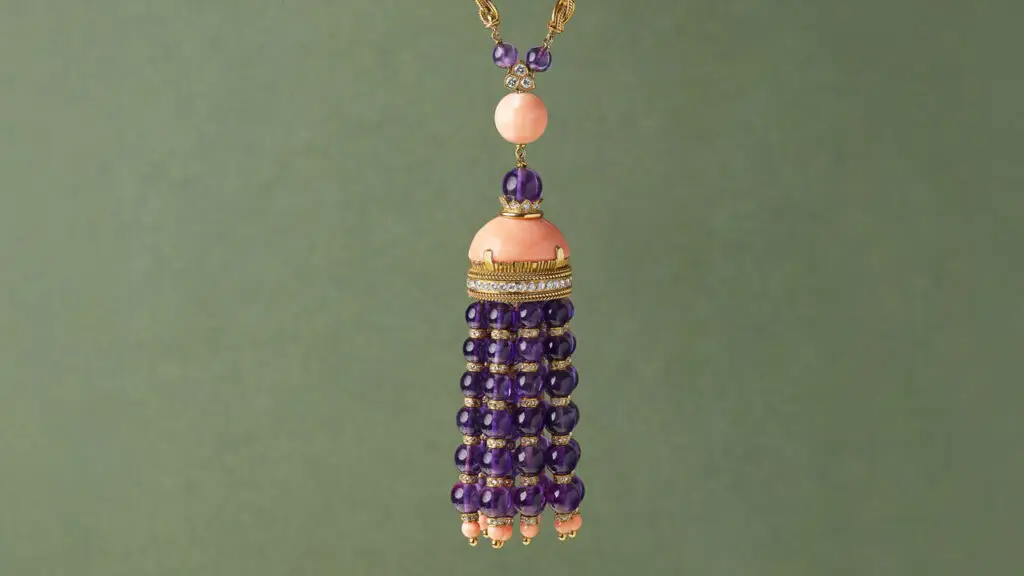 This Van Cleef & Arpels necklace from the 1970s sports a pendant with cabochon coral, drilled coral beads, amethyst beads, and 8.50 carats of round and rose-cut diamonds at Christie's image