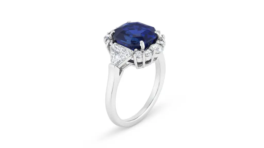 Ring with a modified octagonal step-cut, royal-blue Kashmir sapphire between triangular-diamond shoulders at Christie's image