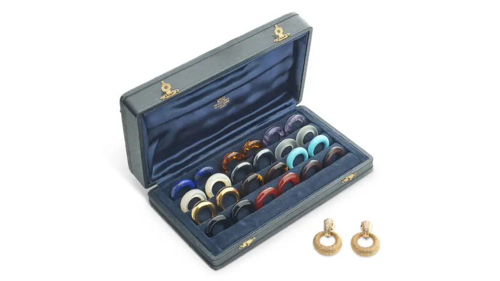 A box comprising 13 pairs of interchangeable hoops. They’re made of frosted rock crystal, turquoise, lapis lazuli, amethyst, carnelian, hematite, onyx, tiger’s eye quartz, amber, wood, mother-of-pearl hoops and round diamonds Christie's image