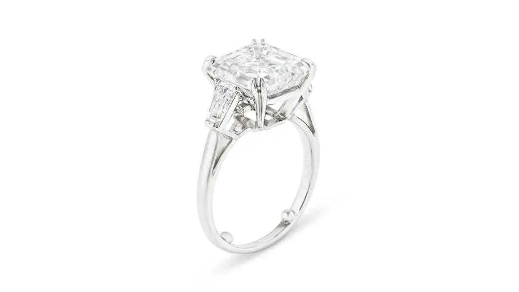 A Tiffany & Co. ring with a square emerald-cut, 7.05-carat, E, VS2 diamond and tapered baguette-cut stones at Christie's image