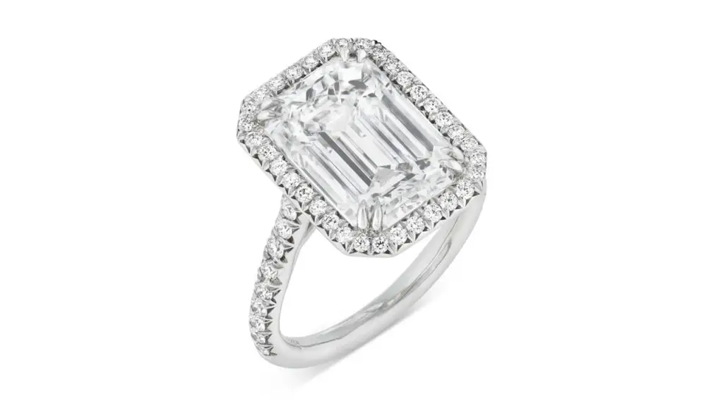 This Tiffany ring centers an emerald-cut, 6.03-carat, G, VS1 diamond, and a surround of round diamonds at Christie's