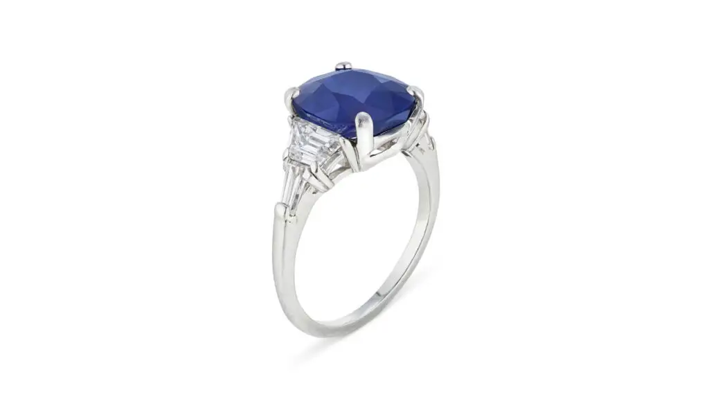 This ring features a cushion mixed-cut 4.81-carat Kashmir sapphire between trapezoid diamonds at Christie's image