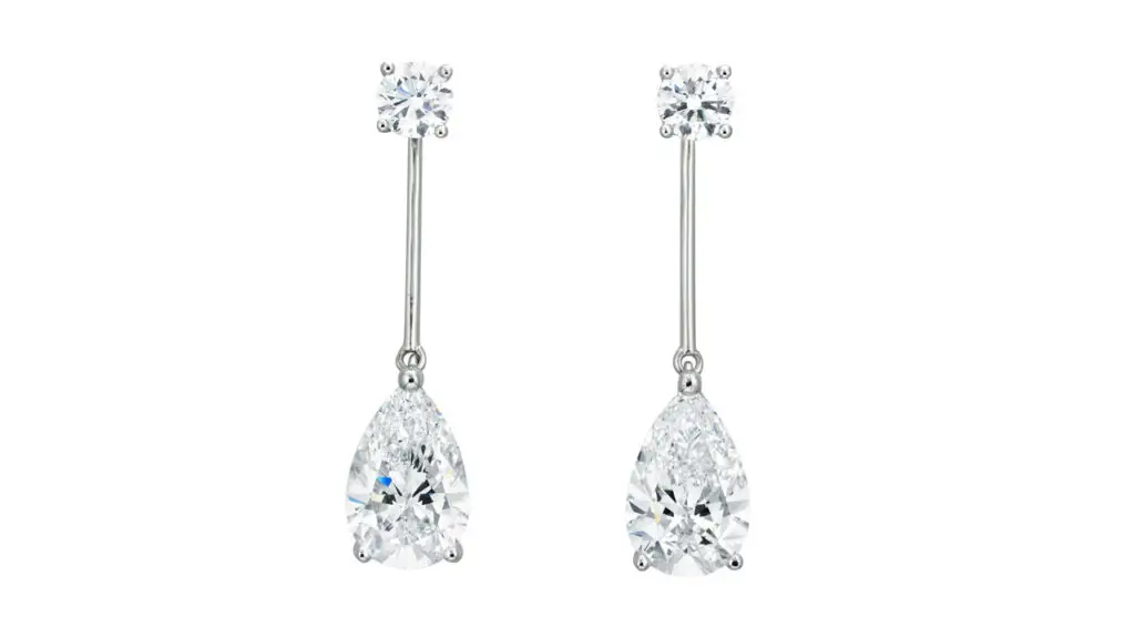 Pear-brilliant-cut, D, VVS1 diamonds of 3.25 and 3.28 carats hang from round diamonds in these earrings at Christie's image