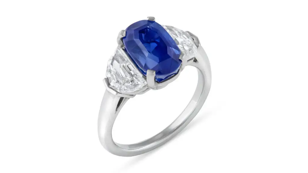 This ring bears an oval step-cut, 4.74-carat Kashmir sapphire between a pair of epaulette-cut diamonds at Christie's