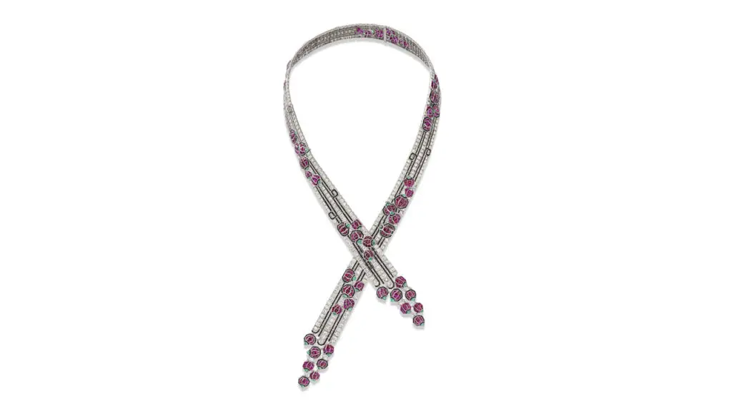 A Boucheron Art Deco necklace, created in the 1920s, bears rubies, emeralds, onyx baguettes, and old- and single-cut diamonds. It has four detachable sections and can be worn long or as a choker and two bracelets at Christie's image