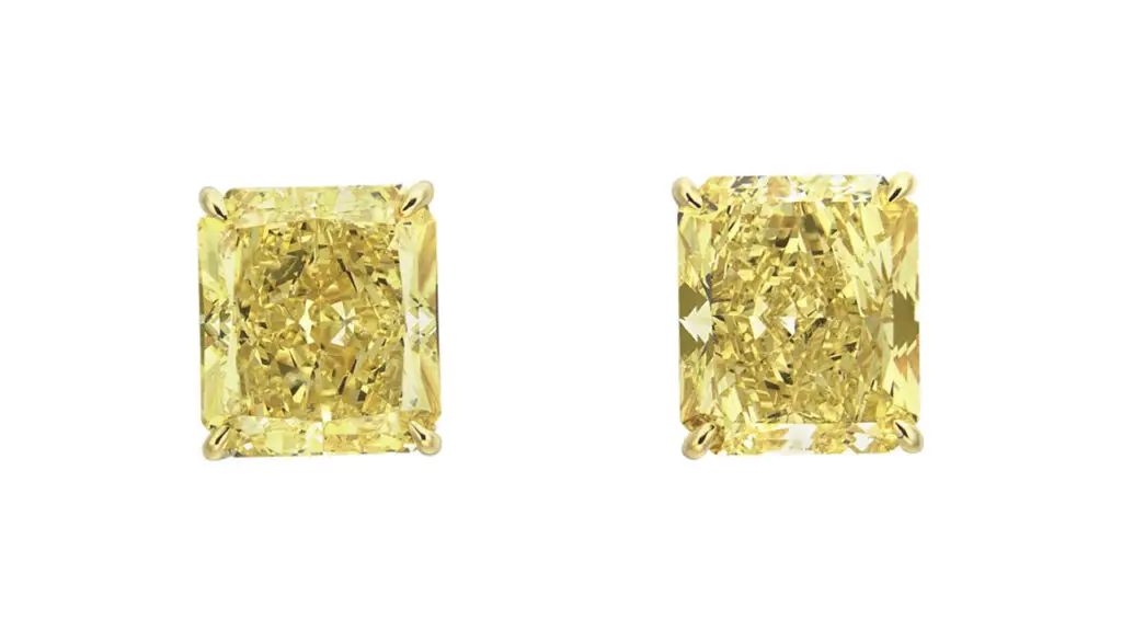 Colored-diamond earrings with two cut-cornered rectangular modified brilliant-cut stones — one a 5.12-carat fancy-intense yellow with SI1-clarity, and the other a 5.23-carat fancy-vivid yellow at Christie's image