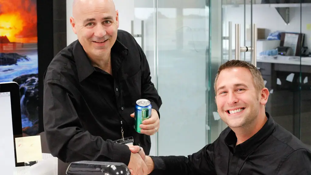 Indelicato with a customer at the company headquarters image