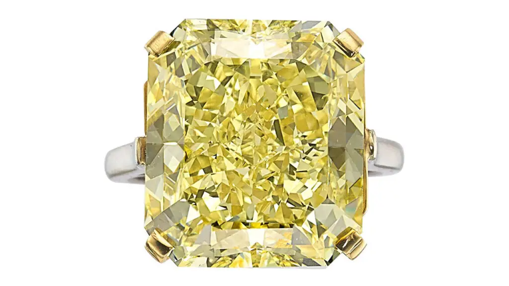 A Cartier ring bearing a cut-cornered rectangular modified brilliant-cut, 20.03-carat, fancy-intense-yellow, VVS2-clarity diamond at Heritage Auctions image