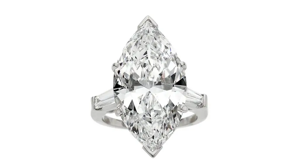 This ring has a marquise-shaped, 12.55-carat, G-color diamond center stone, with tapered baguette-cut side stones at Heritage Auctions image