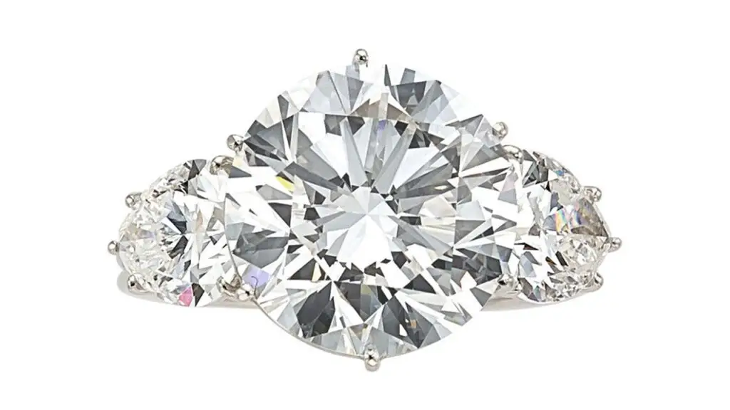 Ring bearing a round brilliant-cut, 5.90-carat, D, VVS2 diamond between a pair of pear-shaped diamonds at Heritage Auction image