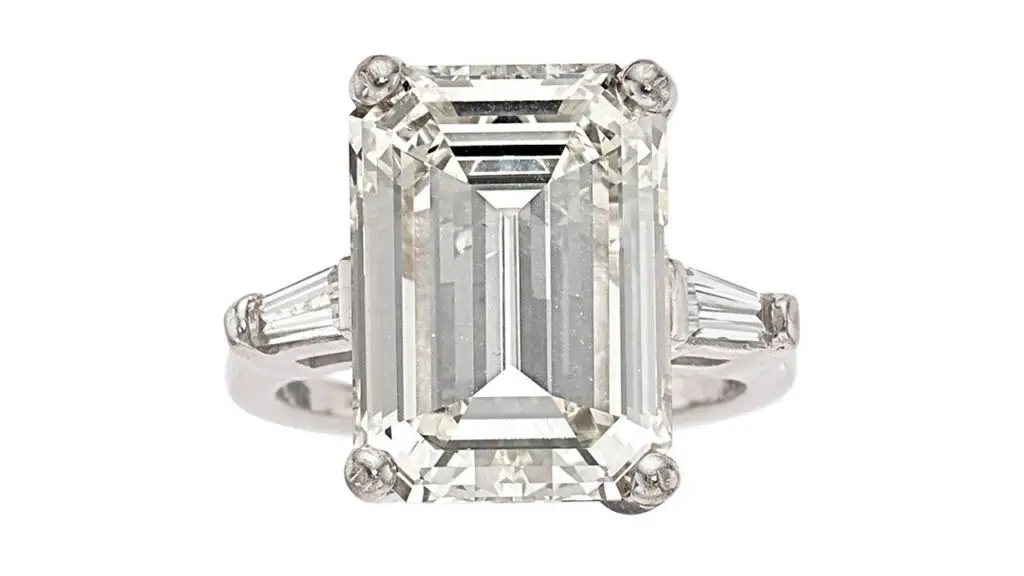 This ring centers an emerald-cut, 9.69-carat, K, VVS2 diamond with two additional baguette diamonds at Heritage Auction image