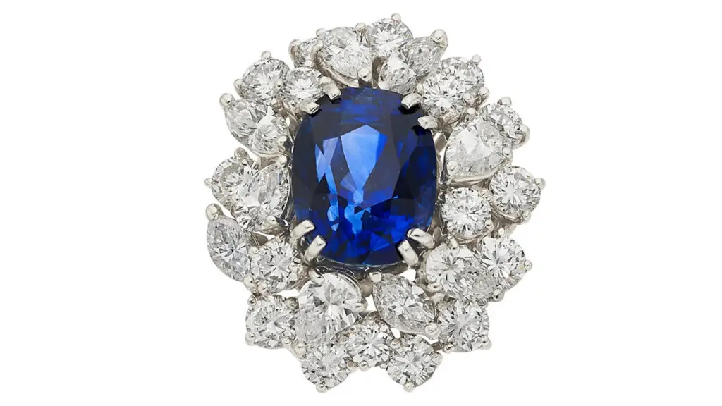 A ring bearing a cushion-shaped, 10.01-carat Kashmir sapphire, with a surround of pear-, marquise-shaped and full-cut diamonds totaling 4.85 carats at Heritage Auctions image
