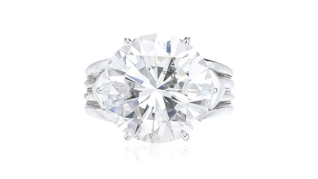 A ring bearing a round brilliant-cut, 7.36-carat, E-color, VVS1-clarity diamond at Poly Auction image