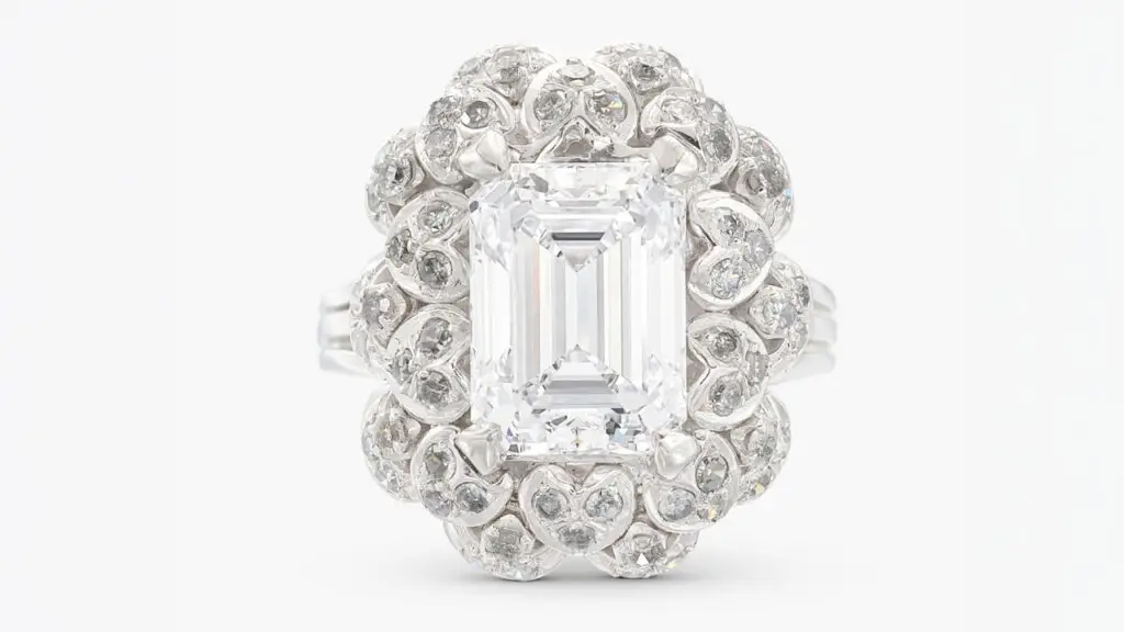 A ring bearing a step-cut, 5.04-carat, D-color, VVS2-clarity diamond with single-cut diamond accents at Sotheby's image