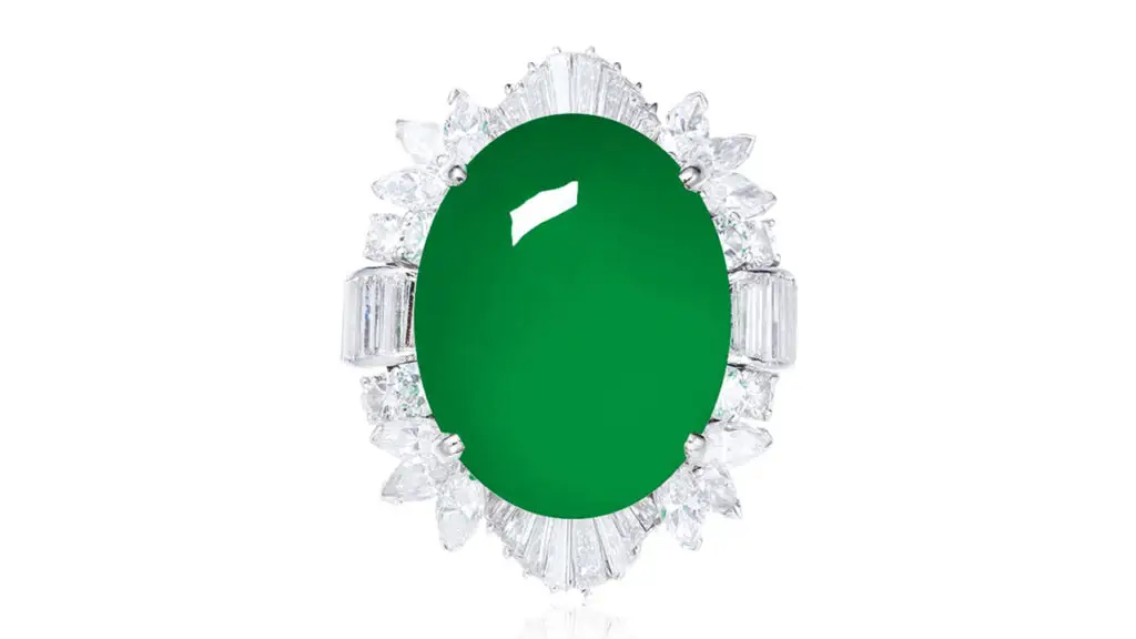 A ring starring a jadeite cabochon in a frame of baguette, marquise and circular-cut diamonds at Poly Auction image