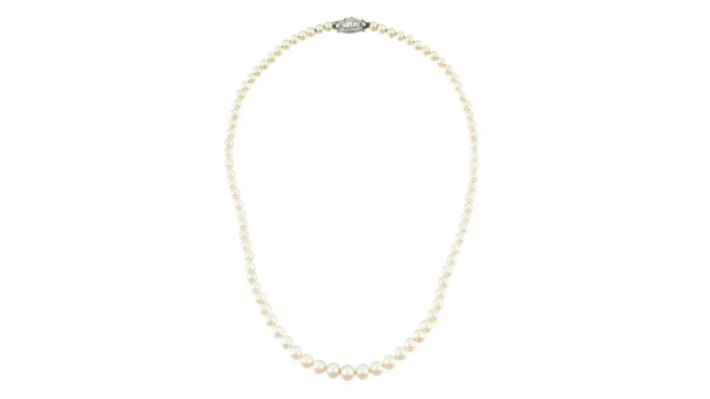A necklace featuring 83 rounded cream-colored pearls and diamond clasp at Sotheby's image