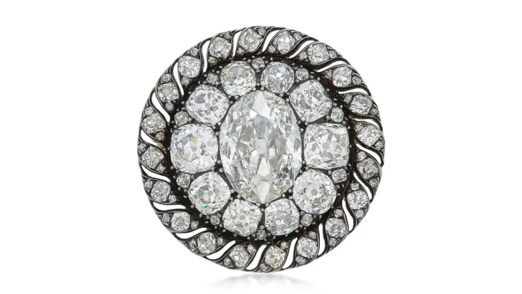 This brooch, which also functions as a pendant, dates back to the early 19th century and once belonged to Napoleon Bonaparte. It features an oval diamond weighing 13.04 carats in a surround of old mine- and mazarin-cut diamonds at Sotheby's image