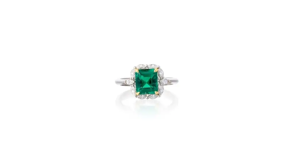 This ring bears an octagonal step-cut, 1.56-carat Colombian emerald in a surround of marquise-shaped diamonds at Phillips auction image