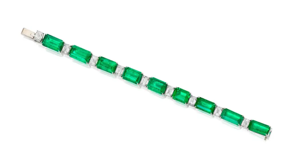 A bracelet bearing nine step-cut Colombian emeralds weighing 36.69 carats, alternating with nine step-cut, G- to H-color, VVS1- to VS2-clarity diamonds totaling 9.57 carats at Phillips image