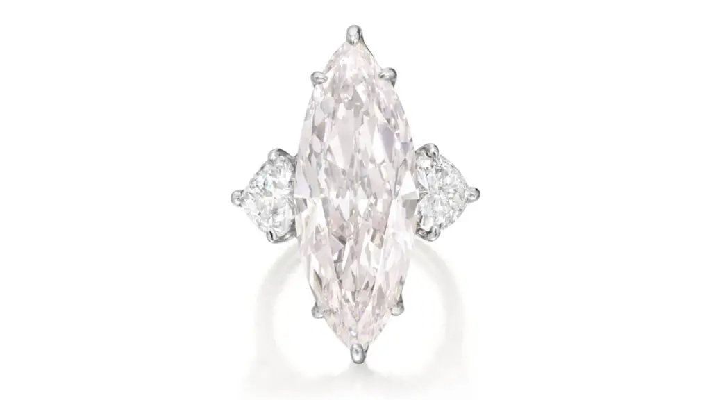 This ring contains a marquise-shaped, 15.12-carat, very-light-pink, VVS2 diamond with the potential to be internally flawless between two heart-shaped diamonds at Phillips image