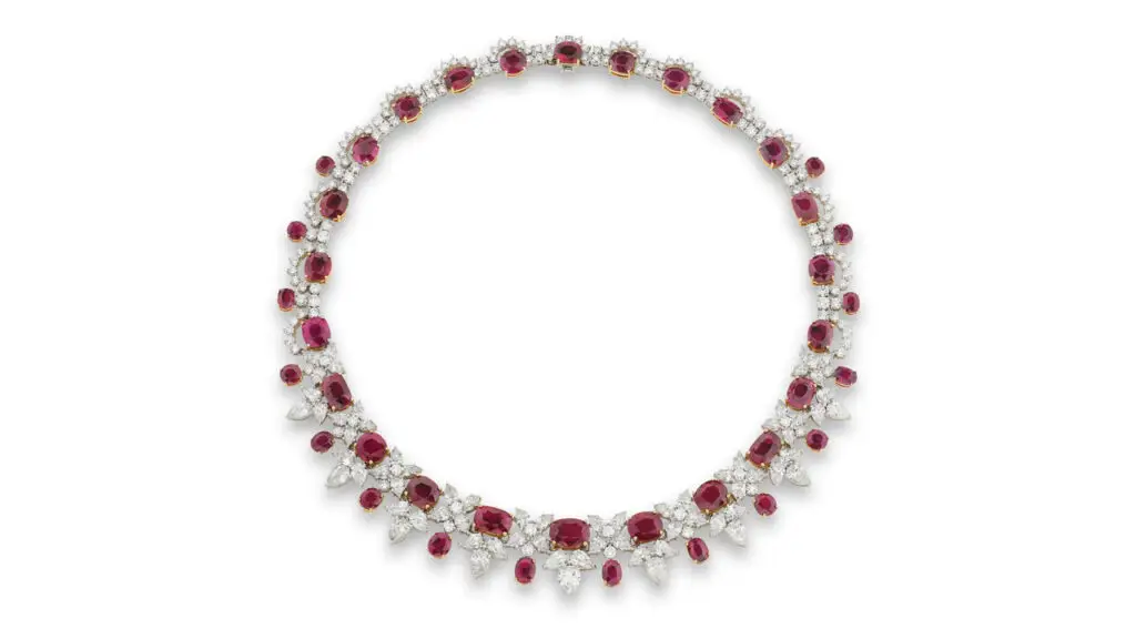 A necklace comprising oval, cushion-shaped and circular-cut rubies between pear-shaped and brilliant-cut diamonds at Phillips image