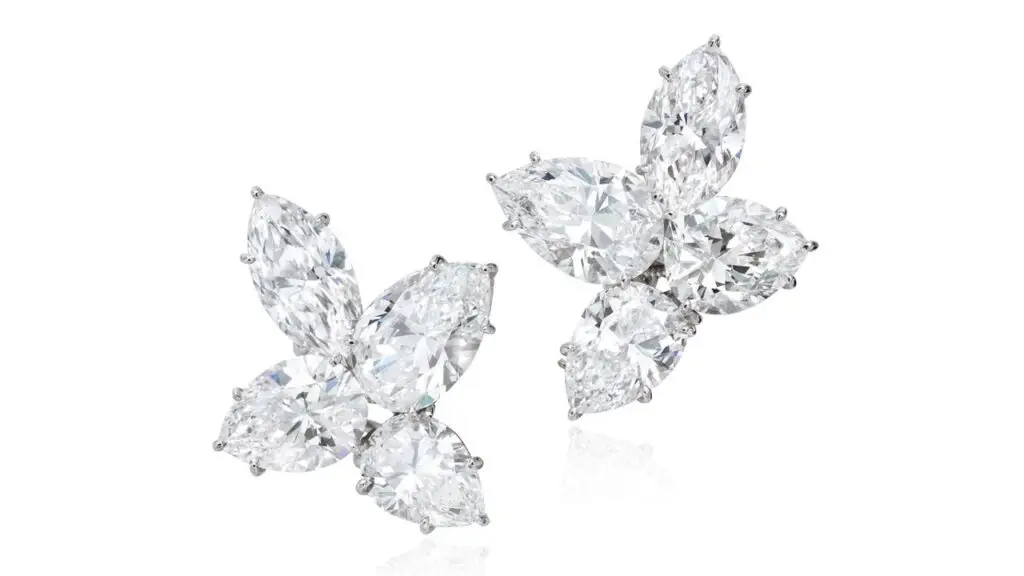 A pair of Harry Winston earrings, each featuring one marquise and three pear-shaped diamonds, with a total weight of around 16.15 carats at Phillips image