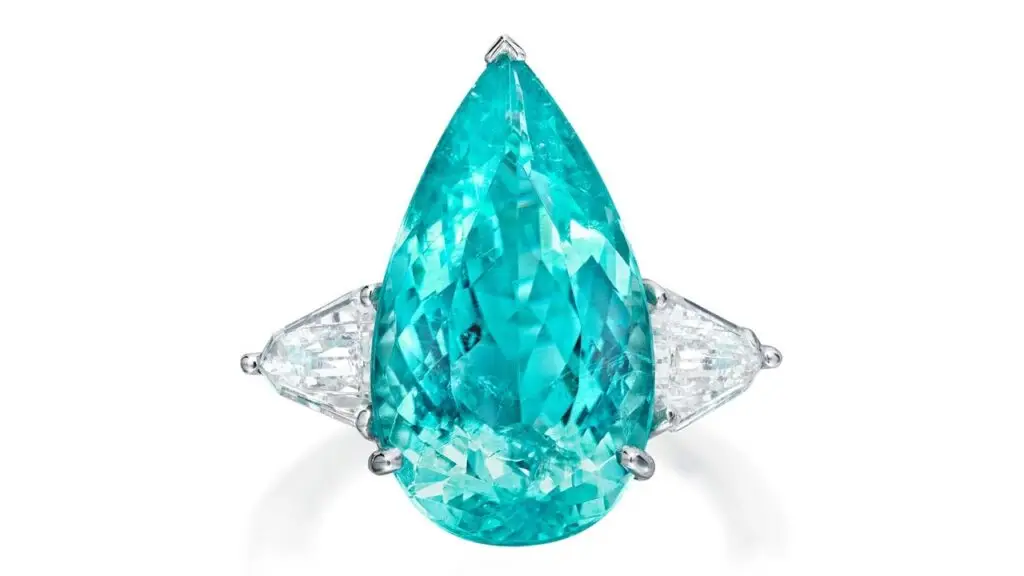 This ring bears a pear-shaped, 9.30-carat Mozambique Paraiba tourmaline between shield-shaped diamonds at Phillips image