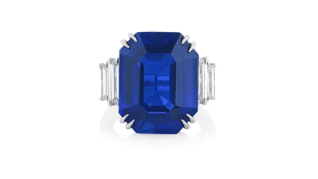This ring features a step-cut, 18.09-carat Kashmir sapphire with diamond shoulders at Phillips image