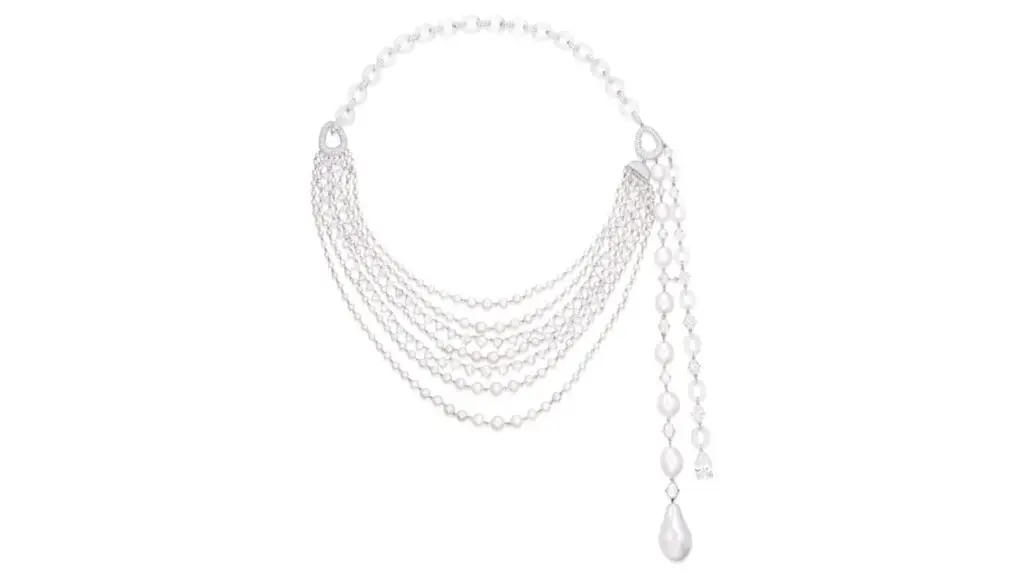 A House of Glenn Spiro necklace features a line of eight graduated natural pearls, highlighted by a pear-shaped 3.02-carat diamond, and decorated with natural pearls, seed pearls, oval, rose- and brilliant-cut diamonds, and icy jadeite hoops at Phillip image